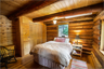 A bedroom in a log home