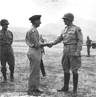 Gen. George S. Patton, Jr., (right) bids farewell to Gen. Bernard Montgomery (left) at the Palermo airport