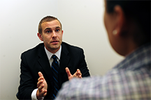 An investigator from the U.S. Air Force Office of Special Investigations interviews a witness