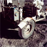 The Apollo 17 Lunar Rover, showing its damaged fender The Apollo 17 Lunar Rover, showing its damaged fender