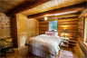 A bedroom in a log home A bedroom in a log home
