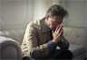 A man in despair, as one might be following a layoff A man in despair, as one might be following a layoff