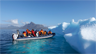 Ecotourists visit an iceberg off Greenland Ecotourists visit an iceberg off Greenland