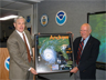 National Weather Service Director Jack Kelly presents civil engineer Herbert Saffir (on right) with a framed poster of Hurricane Andrew depicting the Saffir-Simpson scale for rating the strength of hurricanes National Weather Service Director Jack Kelly presents civil engineer Herbert Saffir (on right) with a framed poster of Hurricane Andrew depicting the Saffir-Simpson scale for rating the strength of hurricanes