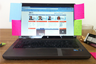 A laptop with password stickies A laptop with password stickies
