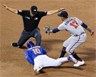 Eduardo Escobar called safe at second Eduardo Escobar called safe at second