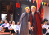 Two men whispering at a village festival Two men whispering at a village festival