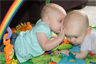 Two infants exchanging secrets Two infants exchanging secrets