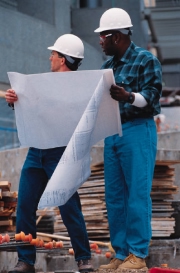 Two construction workers solving a puzzle