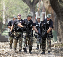 An FBI SWAT team assists local law enforcement in New Orleans in August 2005