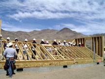 A team raises a wall of a new home sponsored by the U.S. Department of Housing and Urban Development A team raises a wall of a new home sponsored by the U.S. Department of Housing and Urban Development