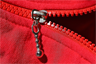 A red molded plastic zipper A red molded plastic zipper